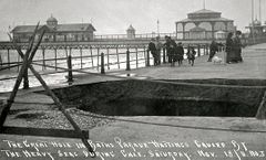 The-great-hole-left-in-the-White-Rock-Parade-Hastings-caused-by-heavy-seas-during-the-gale-on-18th-November-1911.